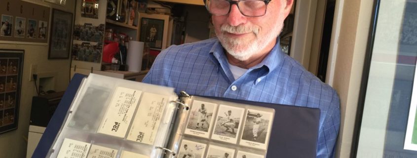 Doug McWilliams displays Oakland Oaks baseball cards photo
